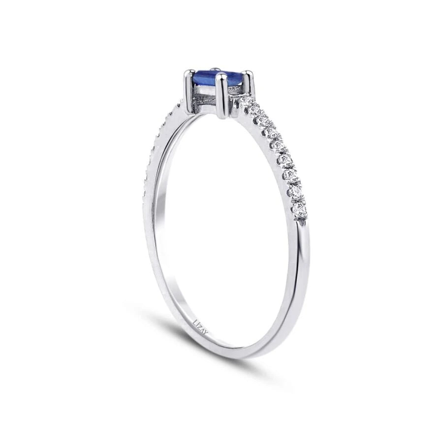 0.22 Carat Diamond Sapphire Emerald Cut Ring