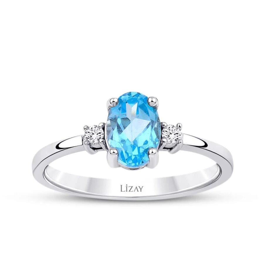 Ring mit 1,07 Karat Diamant und blauem Topas