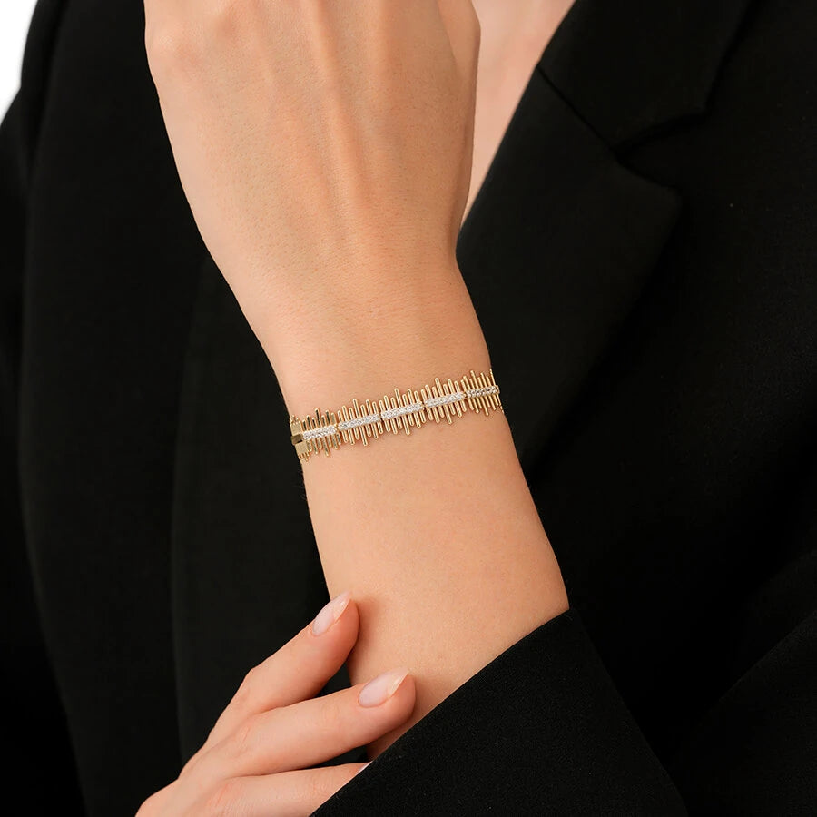 Goldenes Zickzack-Armband mit Steinen
